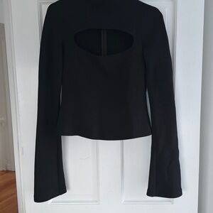 Awkward mood Black Women turtleneck with cut out chest.